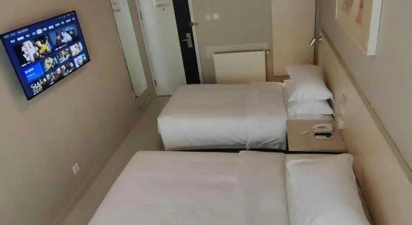 Bed in Jinjiang Inn Qingdao International Exhibition Center Haier Road