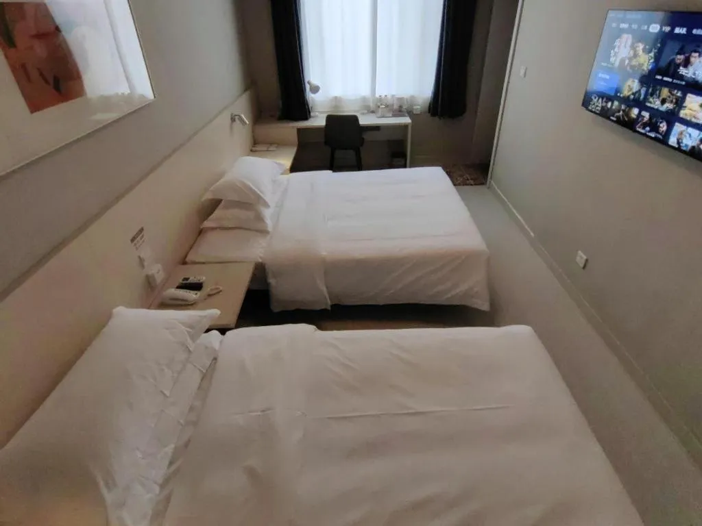 Bed in Jinjiang Inn Qingdao International Exhibition Center Haier Road