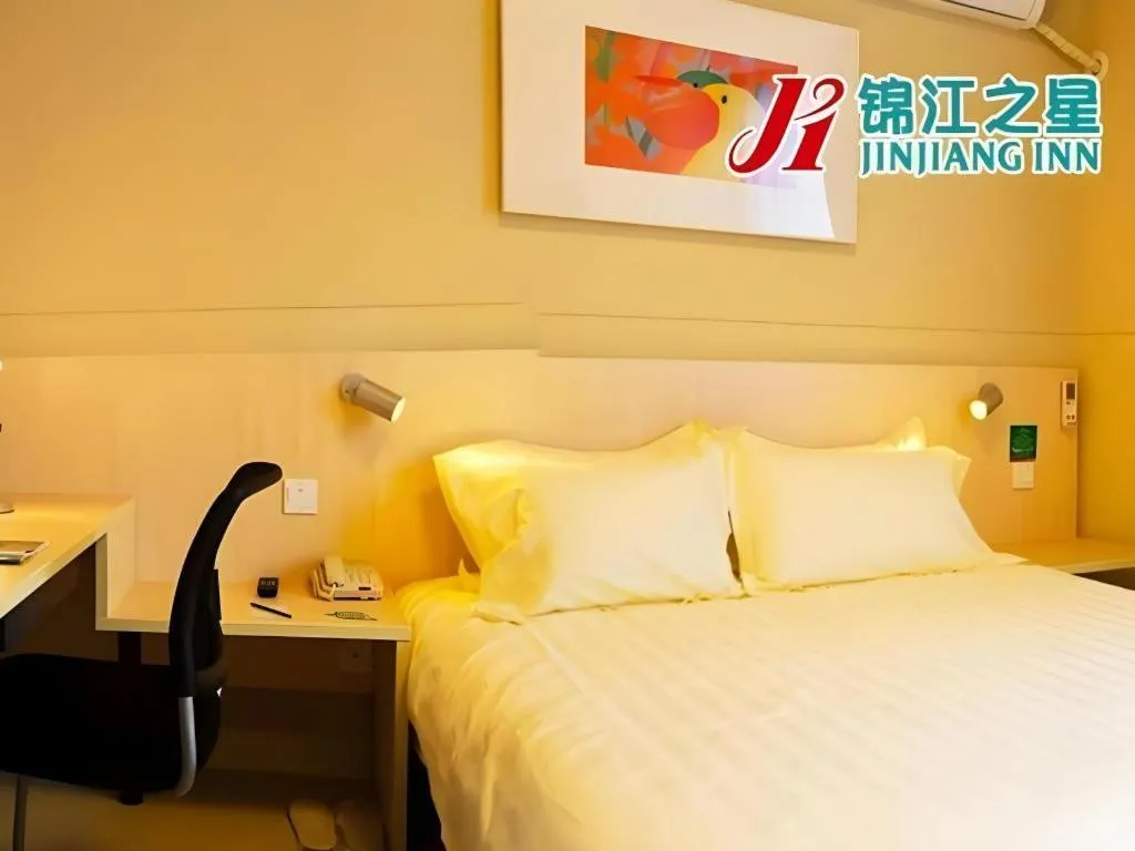 Bed in Jinjiang Inn Qingdao International Exhibition Center Haier Road