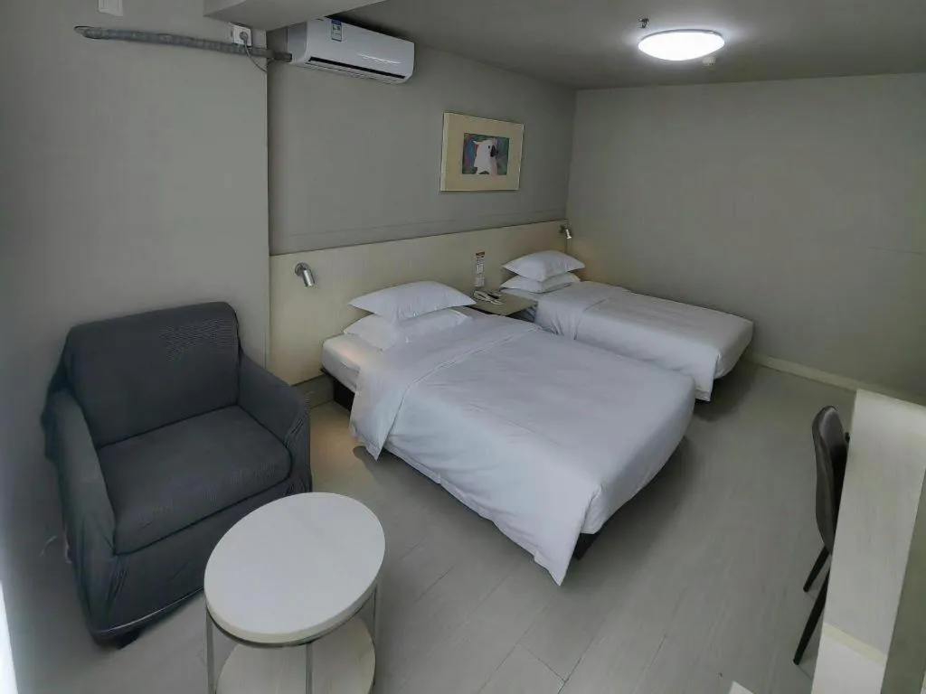 Bed in Jinjiang Inn Qingdao International Exhibition Center Haier Road