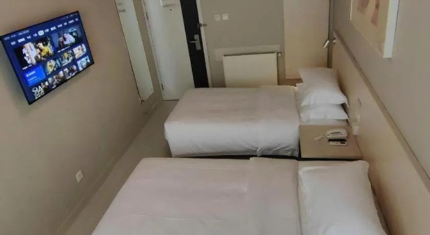 Bed in Jinjiang Inn Qingdao International Exhibition Center Haier Road