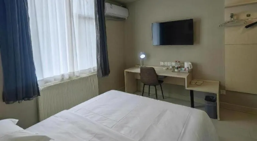 Bed in Jinjiang Inn Qingdao International Exhibition Center Haier Road