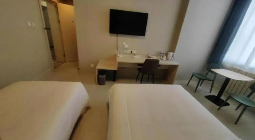 Bed in Jinjiang Inn Qingdao International Exhibition Center Haier Road