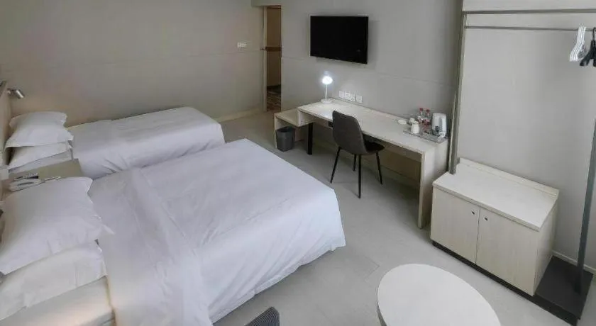 Bed in Jinjiang Inn Qingdao International Exhibition Center Haier Road