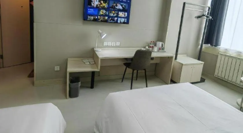 Bed in Jinjiang Inn Qingdao International Exhibition Center Haier Road