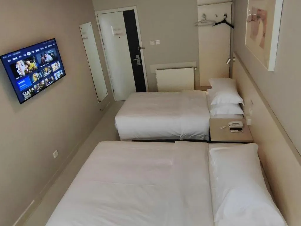 Bed in Jinjiang Inn Qingdao International Exhibition Center Haier Road