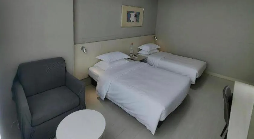 Bed in Jinjiang Inn Qingdao International Exhibition Center Haier Road