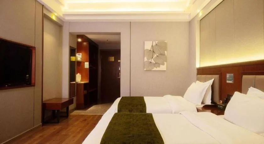 Bed in GreenTree Inn Jiuquan Century Plaza Hotel