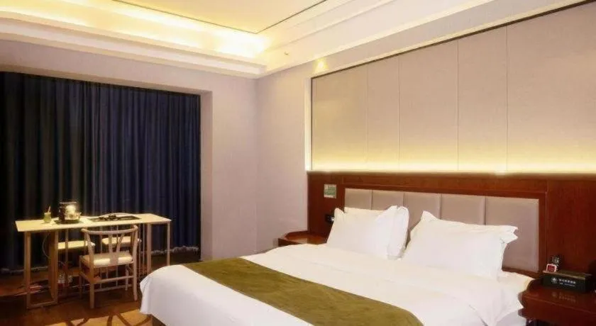 Bed in GreenTree Inn Jiuquan Century Plaza Hotel