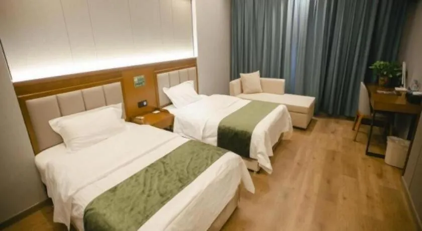 Bed in GreenTree Inn Jiuquan Century Plaza Hotel