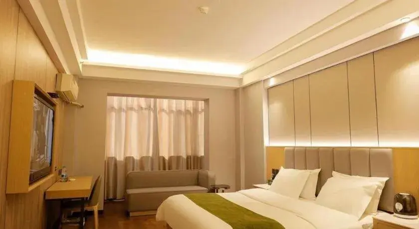 Bed in GreenTree Inn Jiuquan Century Plaza Hotel Bed in GreenTree Inn Jiuquan Century Plaza Hotel