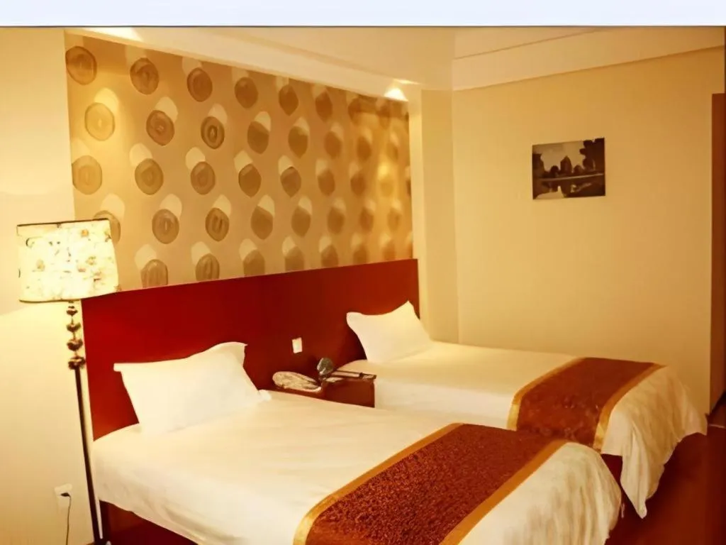 Bed in GreenTree Inn Jiuquan Century Plaza Hotel