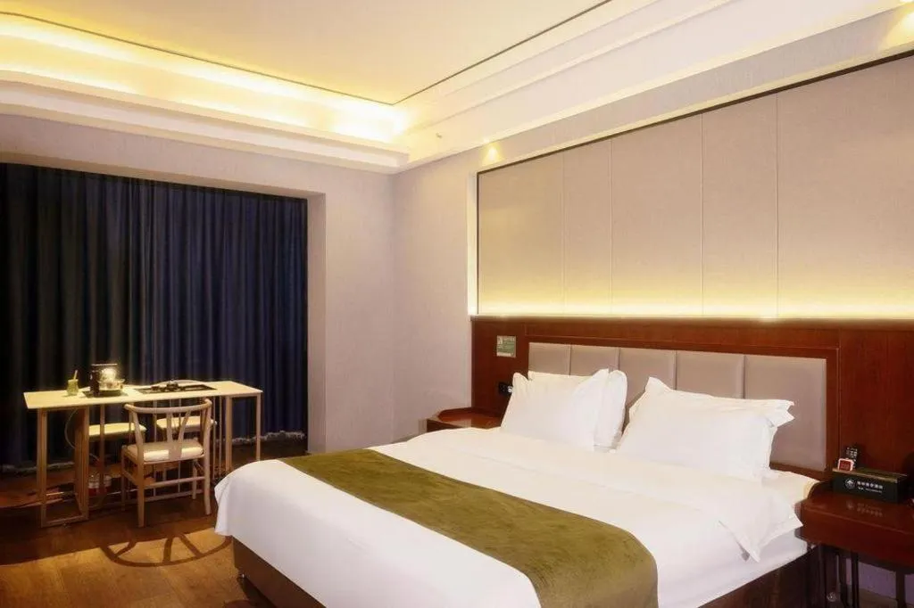 Bed in GreenTree Inn Jiuquan Century Plaza Hotel