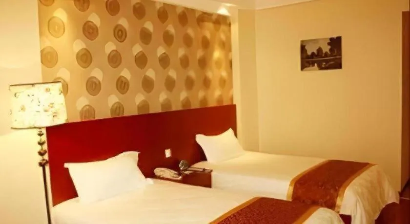 Bed in GreenTree Inn Jiuquan Century Plaza Hotel