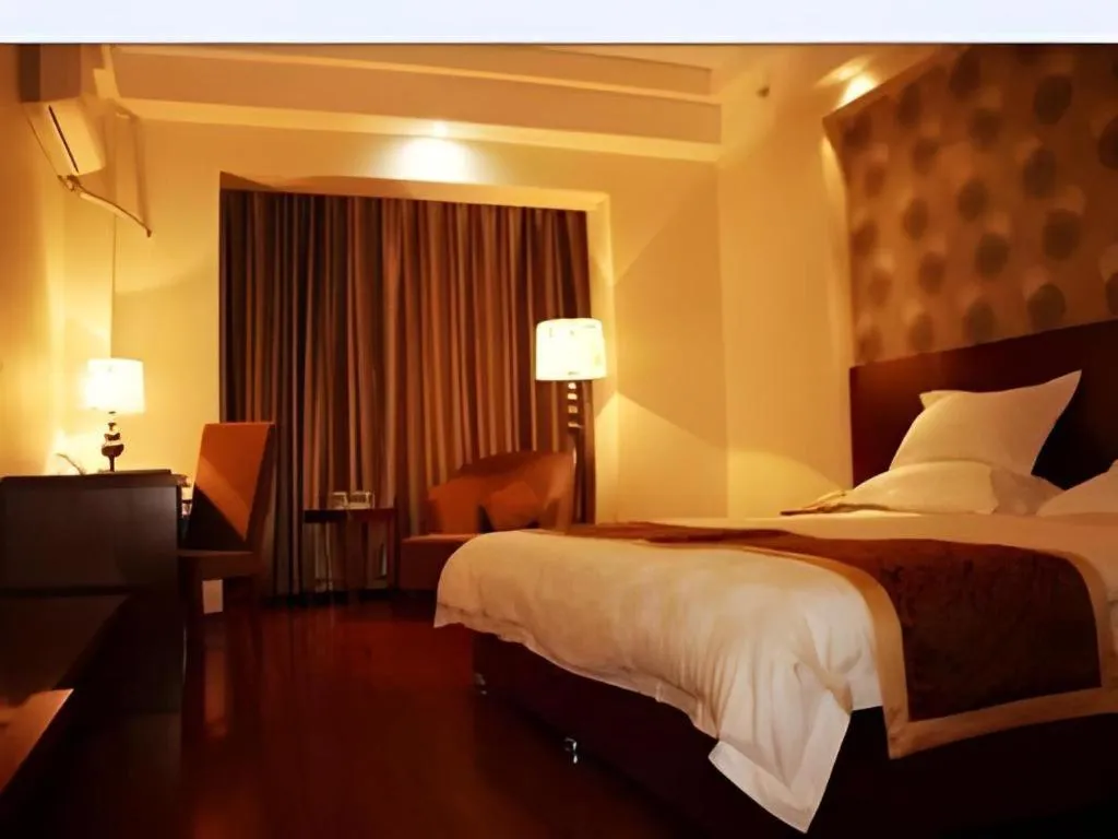 Bed in GreenTree Inn Jiuquan Century Plaza Hotel