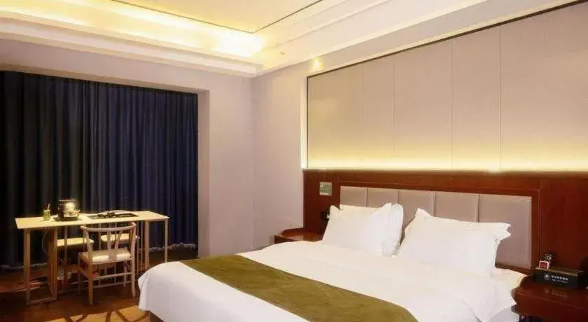 Bed in GreenTree Inn Jiuquan Century Plaza Hotel Bed in GreenTree Inn Jiuquan Century Plaza Hotel