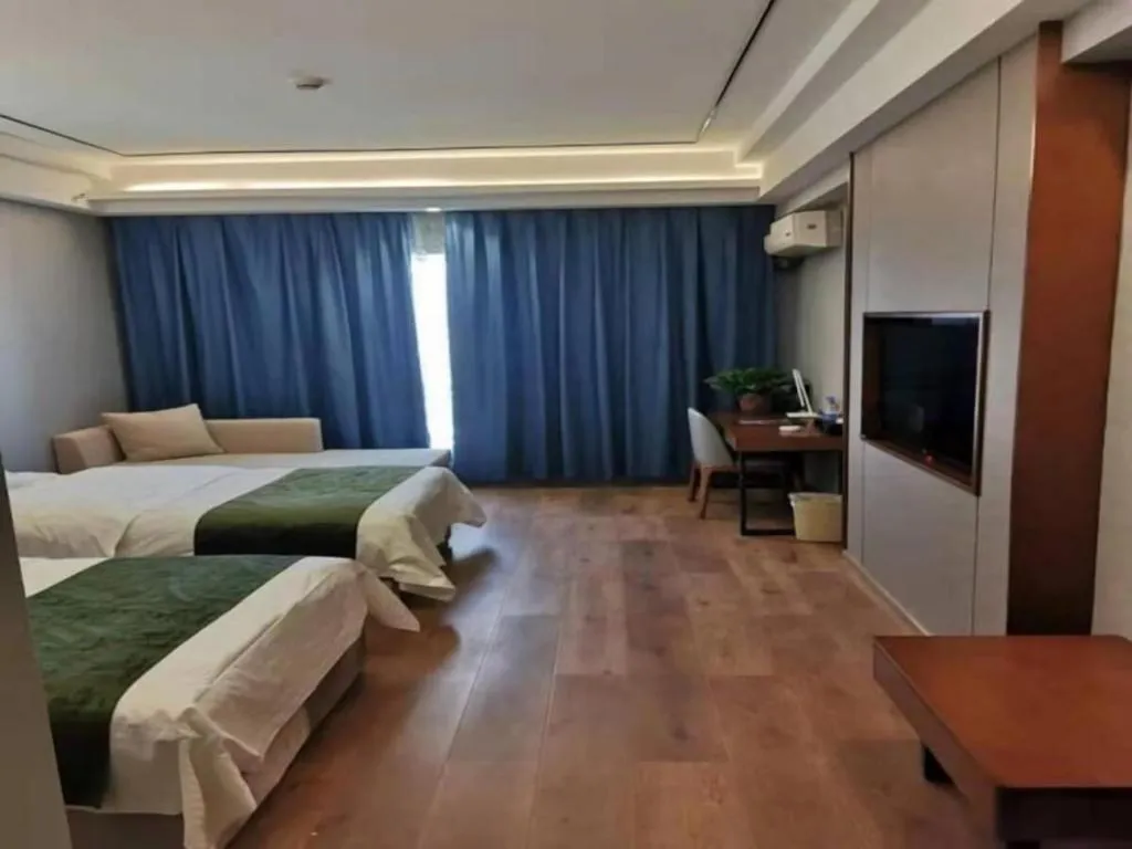 Bed in GreenTree Inn Jiuquan Century Plaza Hotel