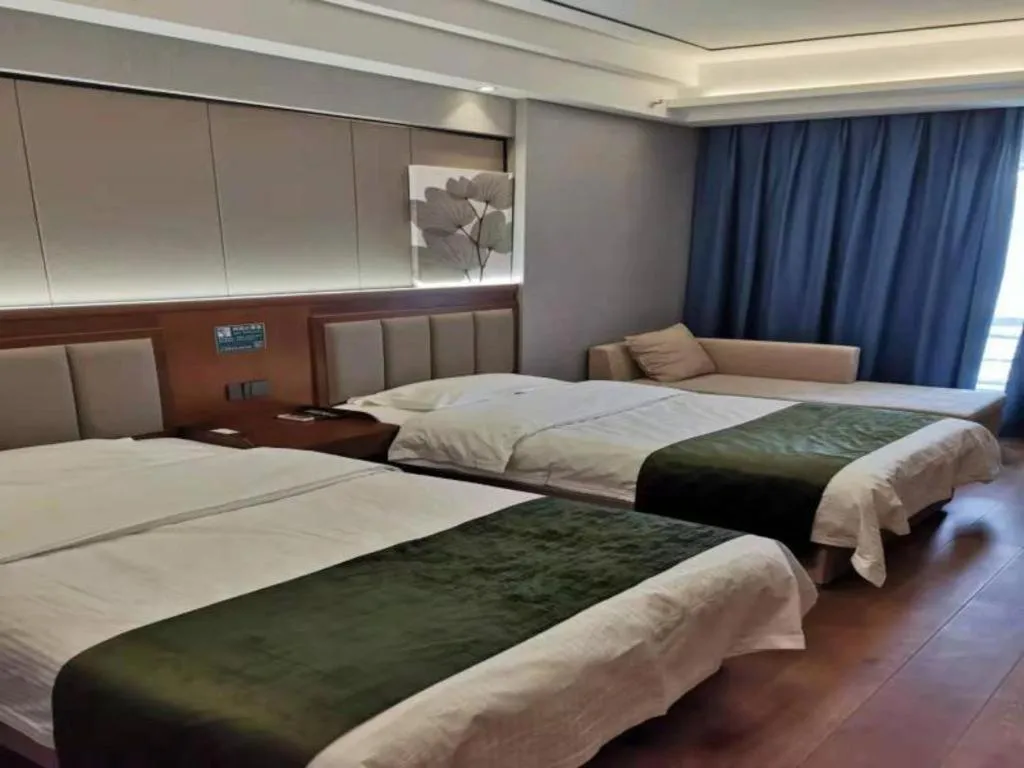 Bed in GreenTree Inn Jiuquan Century Plaza Hotel