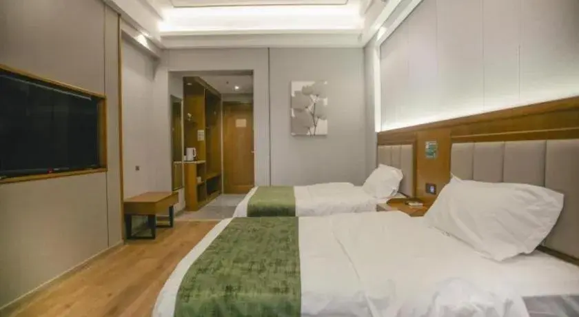 Bed in GreenTree Inn Jiuquan Century Plaza Hotel Bed in GreenTree Inn Jiuquan Century Plaza Hotel