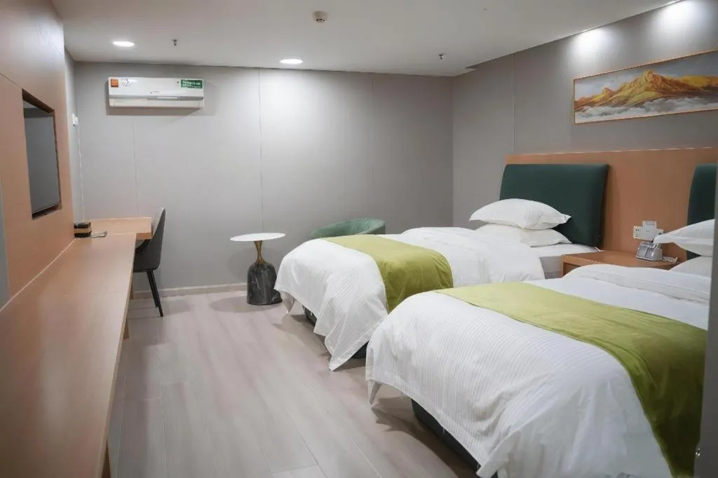 Bed in GreenTree Inn Taicang Baolong Square Hotel