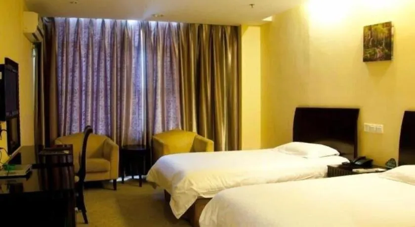 Bed in GreenTree Inn Taicang Baolong Square Hotel