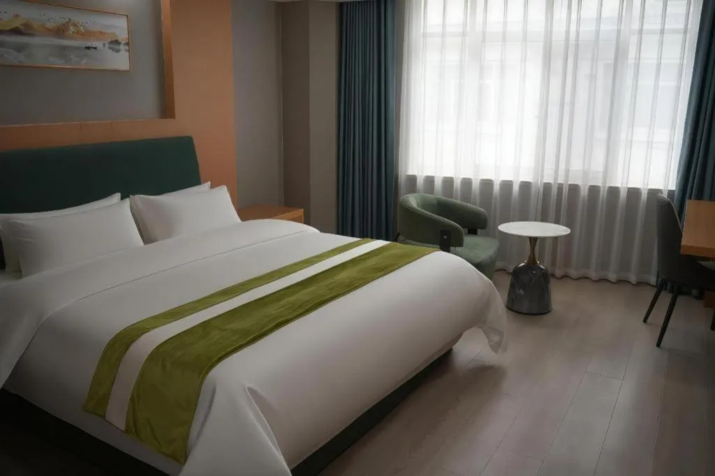 Bed in GreenTree Inn Taicang Baolong Square Hotel