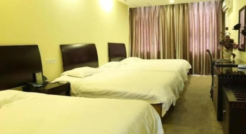 Bed in GreenTree Inn Taicang Baolong Square Hotel