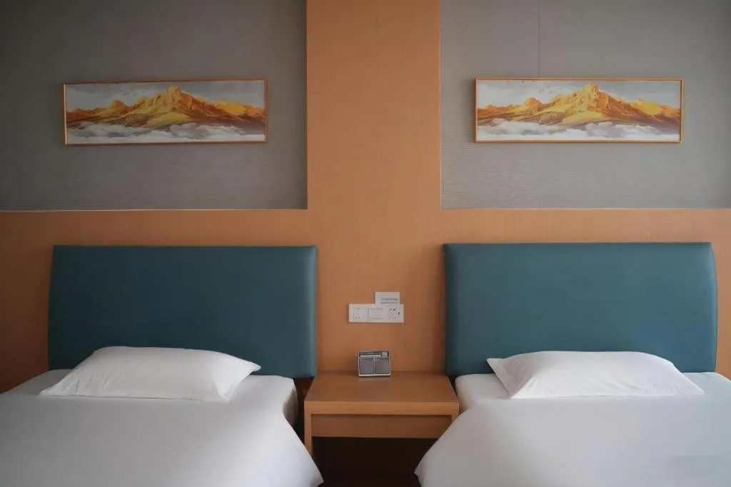 Bed in GreenTree Inn Taicang Baolong Square Hotel