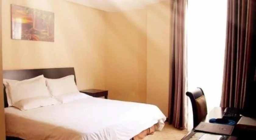 Bed in GreenTree Inn Taicang Baolong Square Hotel