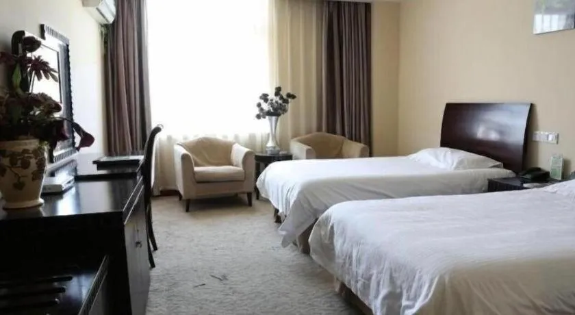 Bed in GreenTree Inn Taicang Baolong Square Hotel