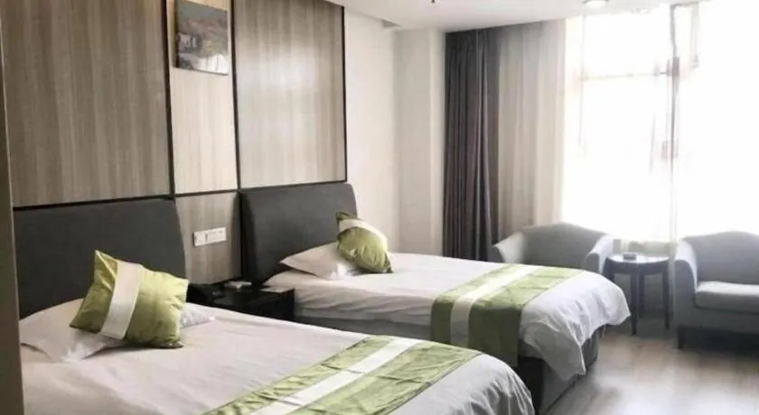 Bed in GreenTree Inn Taicang Baolong Square Hotel