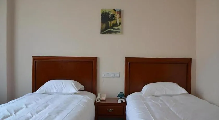 Bed in GreenTree Inn Taicang Baolong Square Hotel