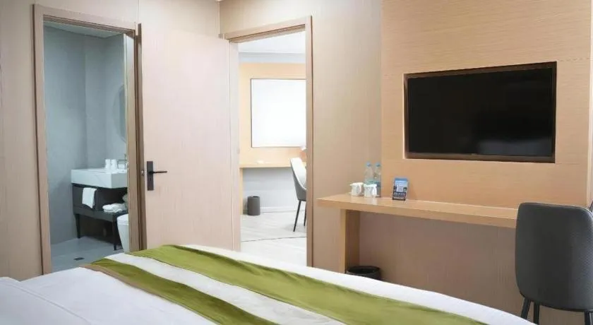 Bed in GreenTree Inn Taicang Baolong Square Hotel