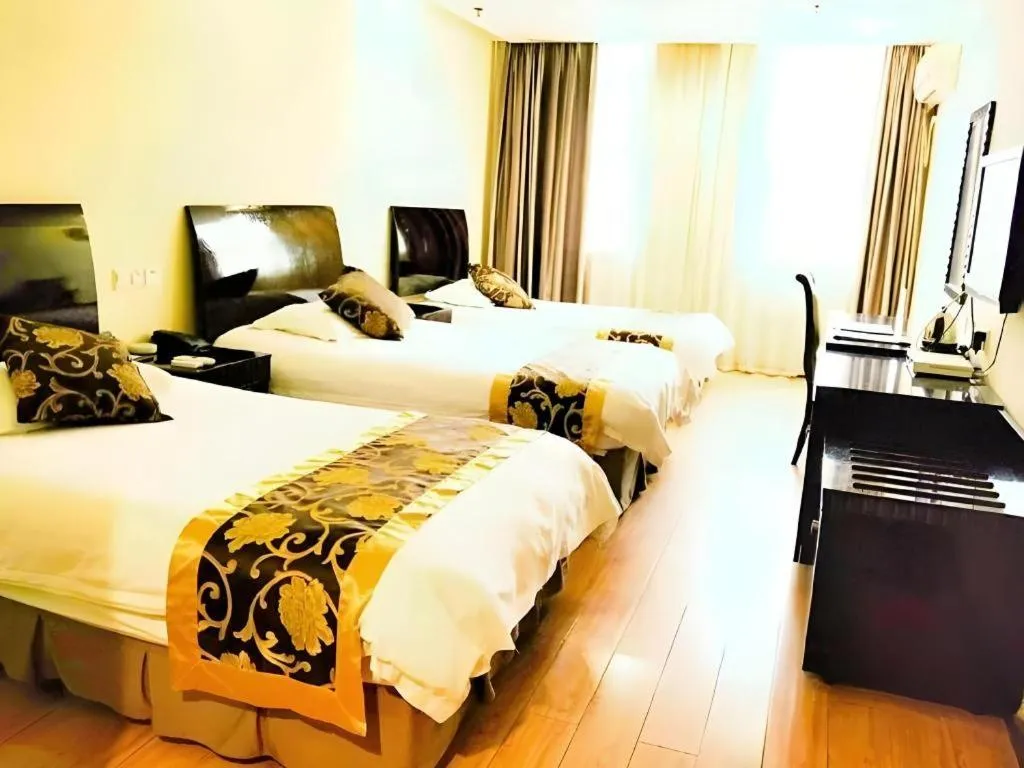 Bed in GreenTree Inn Taicang Baolong Square Hotel