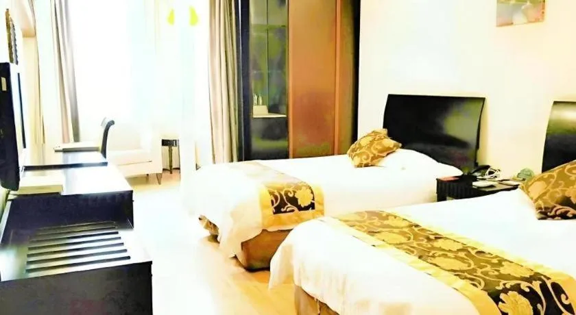 Bed in GreenTree Inn Taicang Baolong Square Hotel