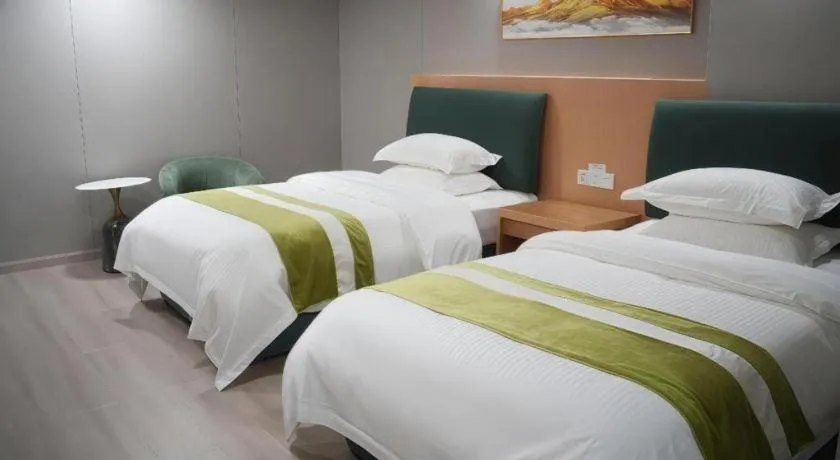 Bed in GreenTree Inn Taicang Baolong Square Hotel