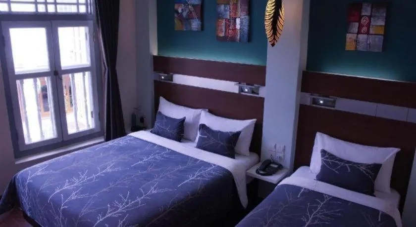 Bed in The Keong Saik Hotel