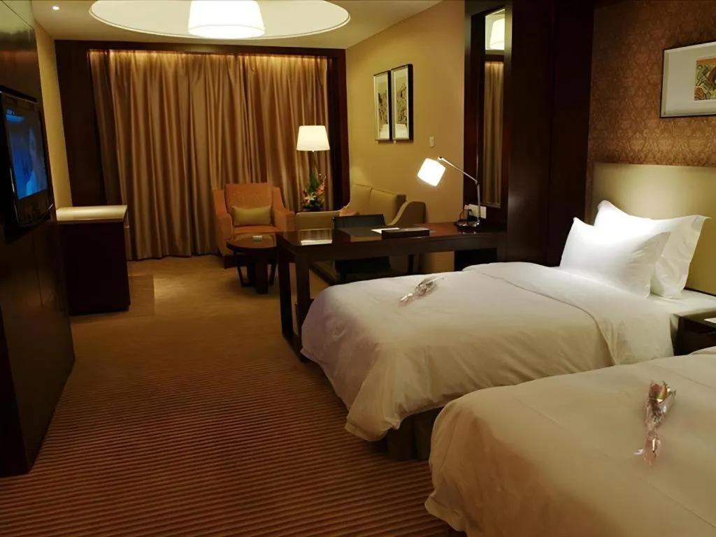 Bed in Yiwu Shinsun International Hotel