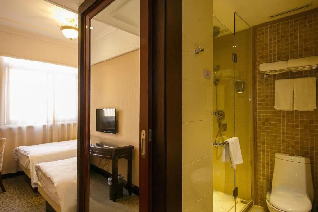 Bed in Hangzhou Silver Star Hotel