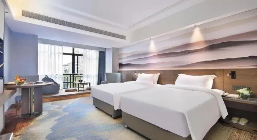 Bed in Vienna Hotel Guangxi Guilin 7-Star Wanda Plaza Bed in Vienna Hotel Guangxi Guilin 7-Star Wanda Plaza