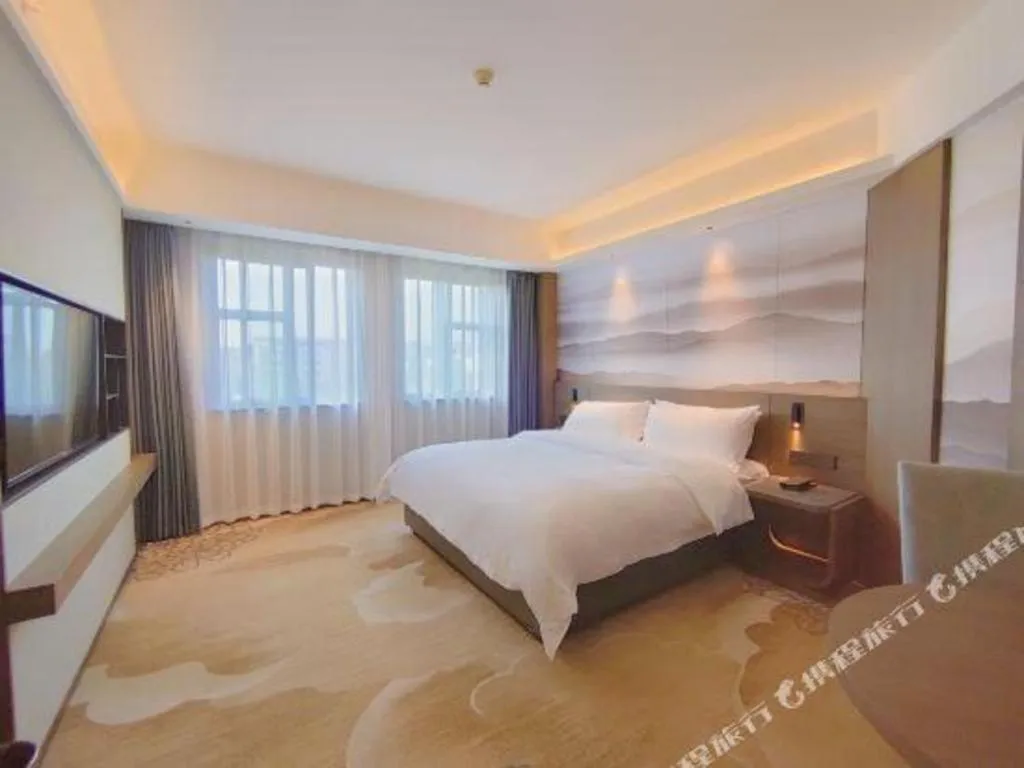 Bed in Vienna Hotel Guangxi Guilin 7-Star Wanda Plaza