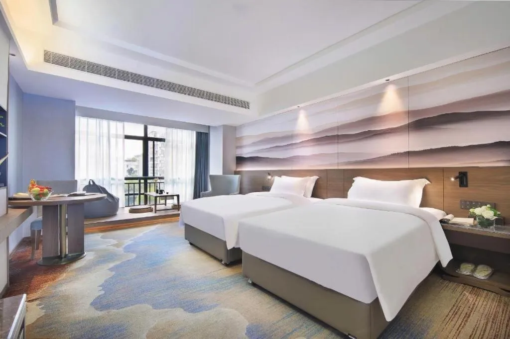 Bed in Vienna Hotel Guangxi Guilin 7-Star Wanda Plaza