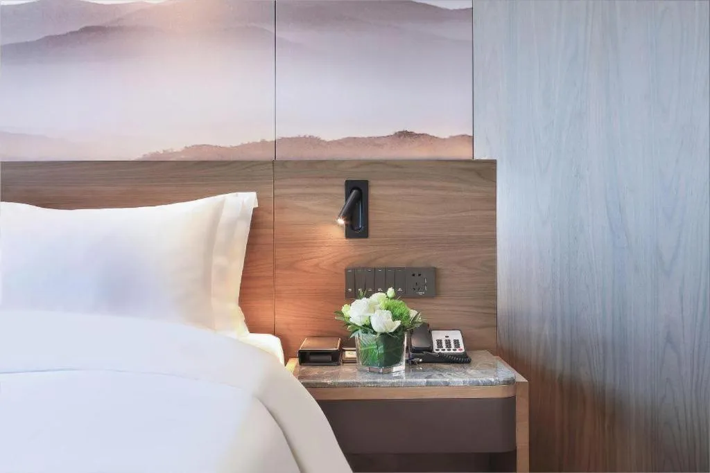 Bed in Vienna Hotel Guangxi Guilin 7-Star Wanda Plaza