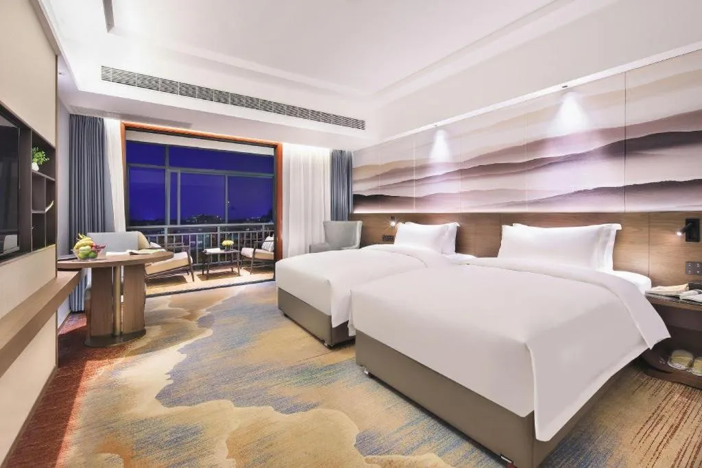 Bed in Vienna Hotel Guangxi Guilin 7-Star Wanda Plaza