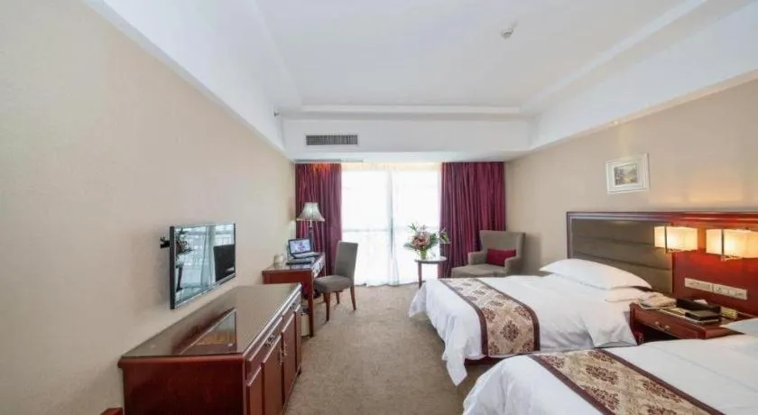 Bed in Vienna Hotel Guangxi Guilin 7-Star Wanda Plaza
