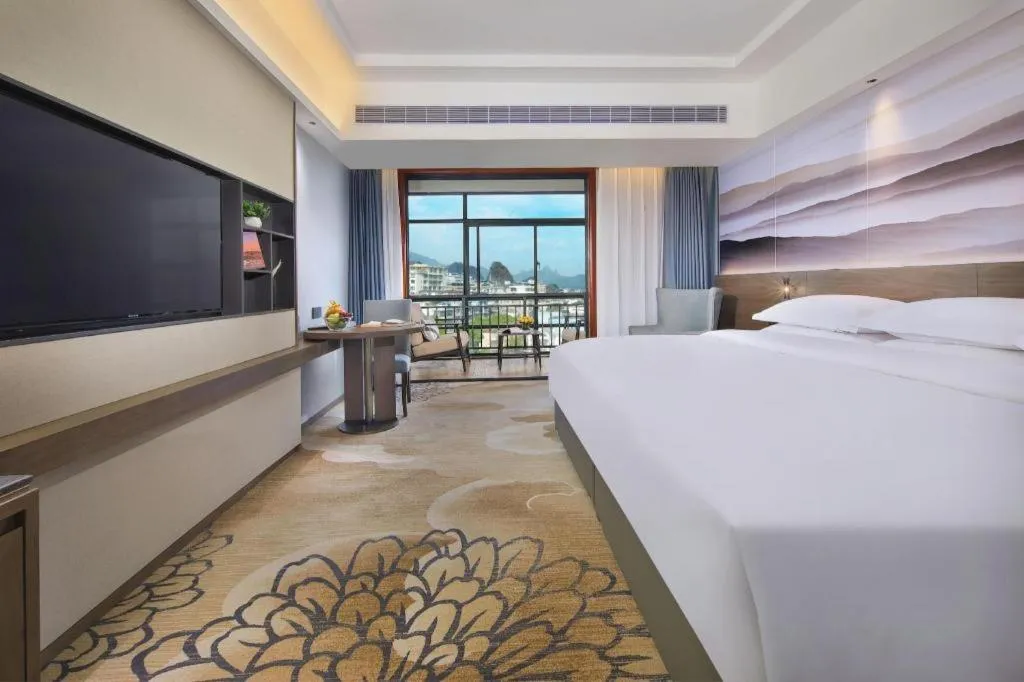 Bed in Vienna Hotel Guangxi Guilin 7-Star Wanda Plaza