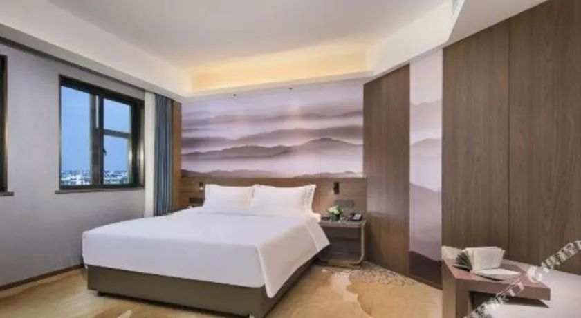 Bed in Vienna Hotel Guangxi Guilin 7-Star Wanda Plaza