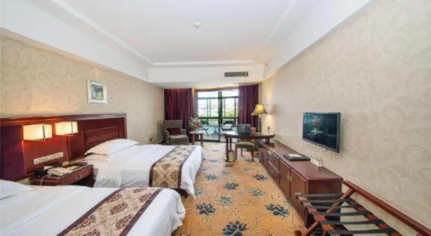 Bed in Vienna Hotel Guangxi Guilin 7-Star Wanda Plaza