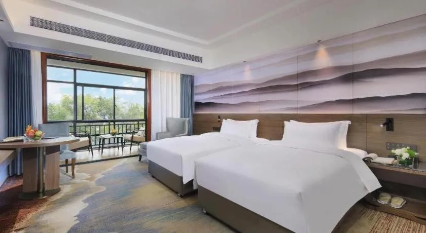 Bed in Vienna Hotel Guangxi Guilin 7-Star Wanda Plaza