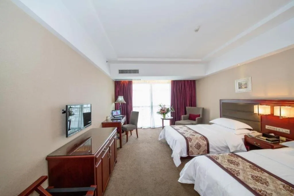 Bed in Vienna Hotel Guangxi Guilin 7-Star Wanda Plaza